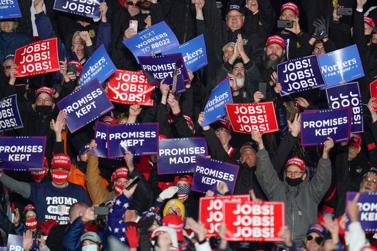 Supporters cheer and wave signs as President Donald Trump addresses the crowd during a campaign stop, at the Butler County Regional Airport in Butler, Pa., on Oct. 31, 2020. (Keith Srakocic/AP Photo)