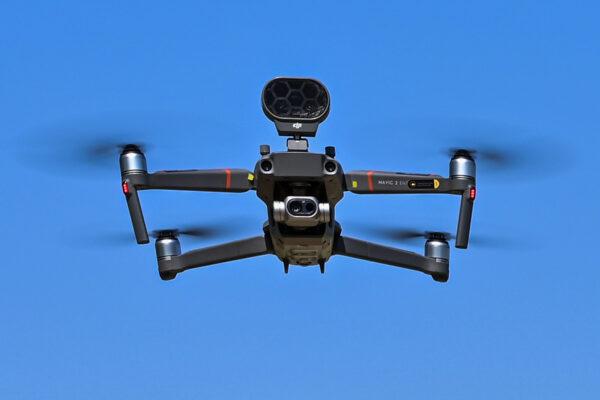 A DJI Mavic 2 Enterprise drone equipped with a thermal sensor, used by police to check people's temperature, is pictured in flight in Treviolo, Italy, on April 9, 2020. (Miguel Medina/AFP via Getty Images)