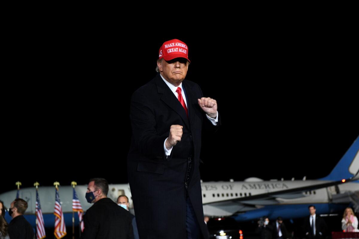President Donald Trump dances as he leaves a campaign rally, in Rome, Ga., on Nov. 1, 2020. (Brandon Bell/Reuters)