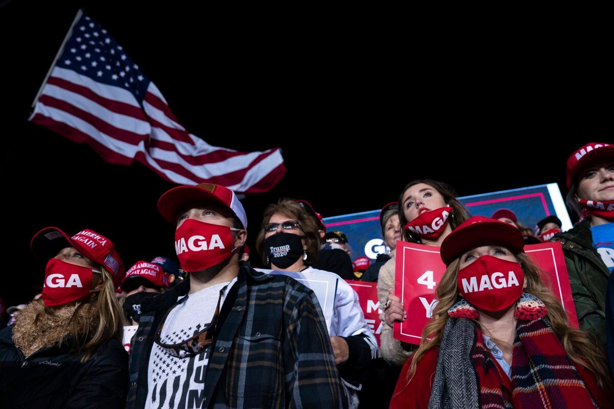 Supporters of President Donald Trump listen to him speak during a campaign rally at Richard B. Russell Airport, in Rome, Ga., Nov. 1, 2020. (Evan Vucci/AP Photo)