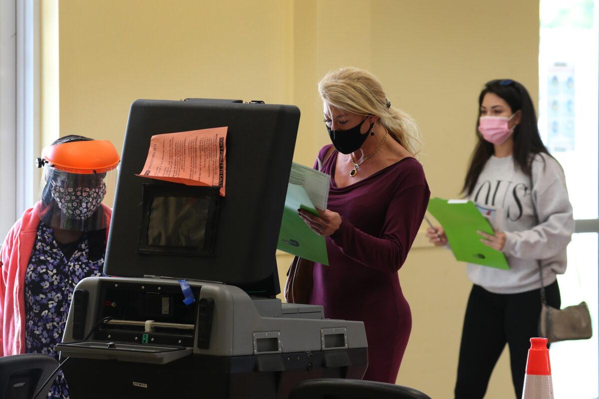 Jannelle Riguez casts her ballot at the Legion Park polling place in Miami, Fla., on Nov. 3, 2020. (Joe Raedle/Getty Images)