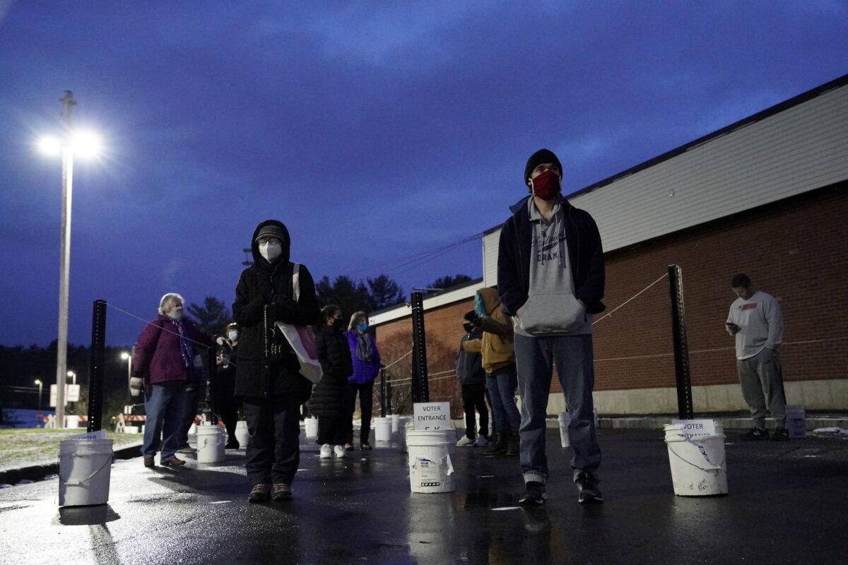 Voters line up at the Waterville Junior High School polling station before doors open during the election in Waterville, Maine, on Nov. 3, 2020. (Elizabeth Frantz/Reuters)