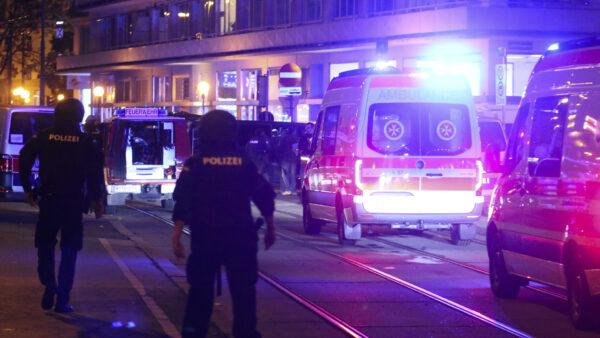 A police officers walk near ambulances at the scene after gunshots were heard, in Vienna, Monday, Nov. 2, 2020. (Ronald Zak/AP)