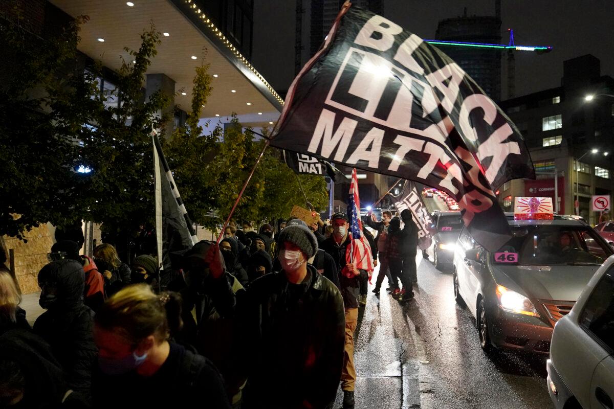 People march on the night of the election in Seattle, on Nov. 3, 2020. (Ted S. Warren/AP Photo)