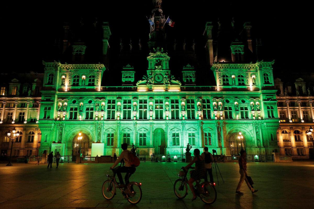 Green lights are projected onto the facade of the Hotel de Ville in Paris, France, after President Donald Trump announced his decision that the United States will withdraw from the Paris Climate Agreement at a news conference on June 1, 2017. (Philippe Wojazer/File Photo via Reuters)