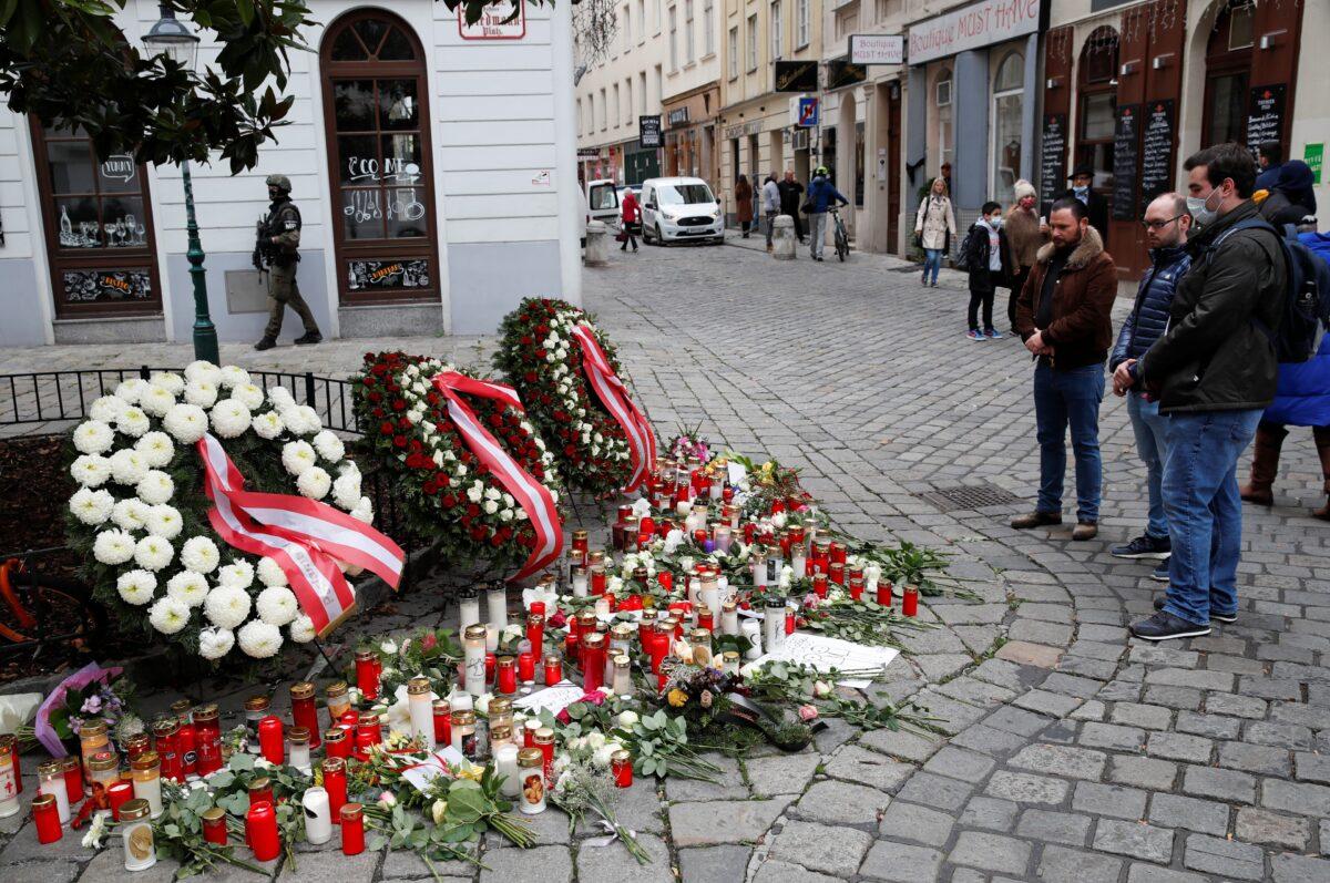 People mourn at the site of a gun attack in Vienna, Austria, on Nov. 4, 2020. (Leonhard Foeger/Reuters)
