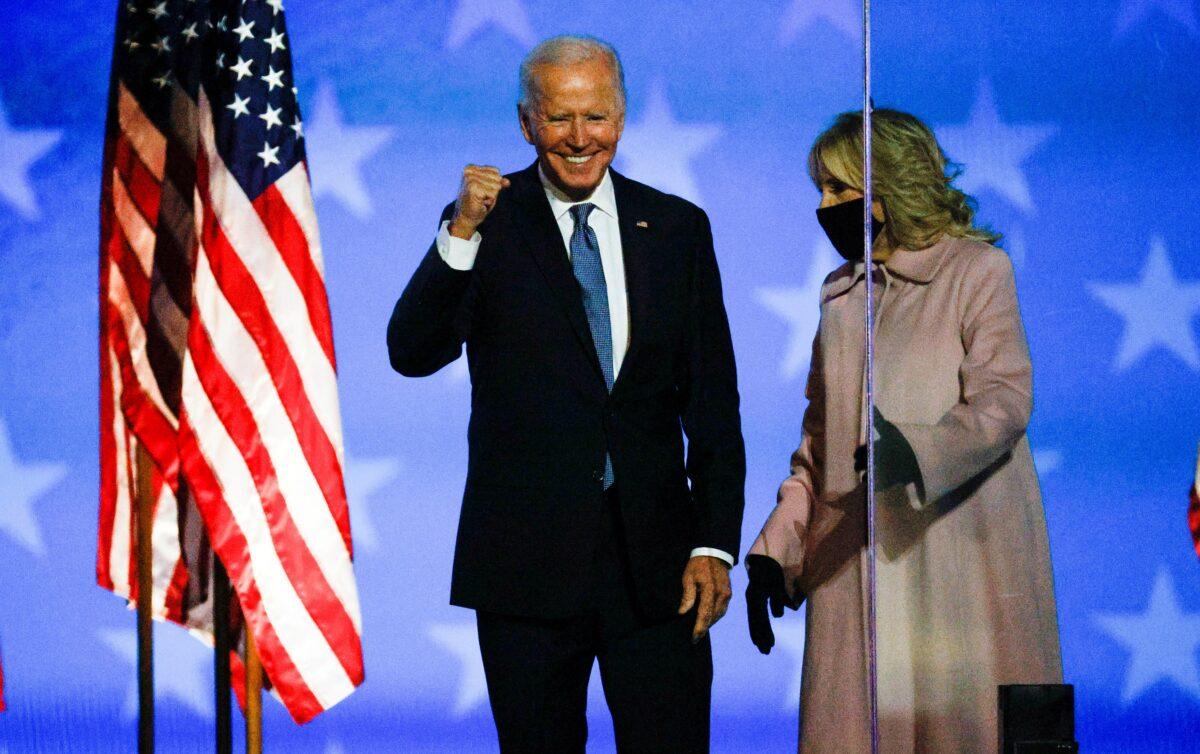 Democratic presidential nominee and former Vice President Joe Biden arrives with his wife Jill to react to early results from the presidential election in Wilmington, Del., on Nov. 4, 2020. (Brian Snyder/Reuters)