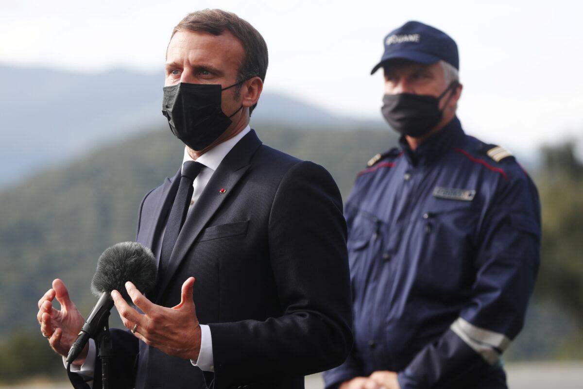 French President Emmanuel Macron speaks to media on strengthening the border controls at the crossing between Spain and France, at Le Perthus, France, on Nov. 5, 2020. (Guillaume Horcajuelo/Pool via Reuters)