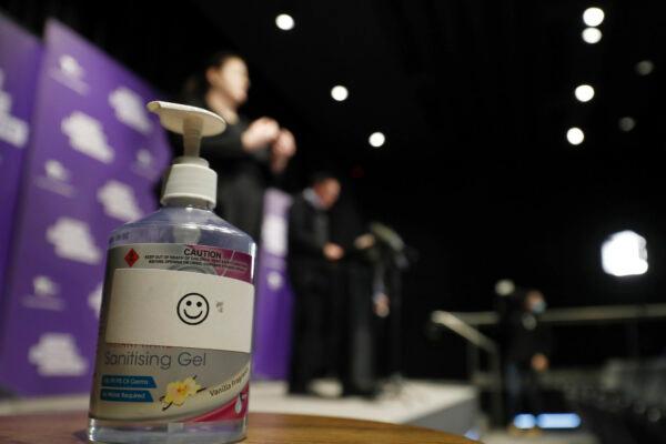 A hand sanitizer is seen as Victorian Premier Daniel Andrews speaks to the media during a daily briefing in Melbourne, Australia on July 25, 2020. (Darrian Traynor/Getty Images)
