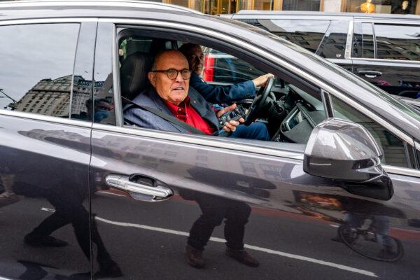 Former New York City Mayor and President Donald Trump's personal attorney Rudy Giuliani drives by a march and rally for Trump in New York City on Oct. 25, 2020. (File/David Dee Delgado/Getty Images)