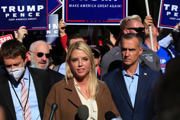 Former Florida Attorney General Pam Bondi, with Trump campaign adviser Corey Lewandowski (C R), speaks outside the Pennsylvania Convention Center in Philadelphia, Pennsylvania on Nov. 5, 2020. (Kena Betancur/AFP via Getty Images)