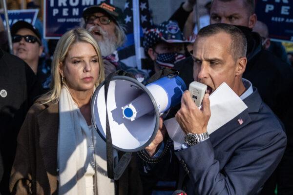 Former campaign adviser to President Donald Trump, Corey Lewandowski (R) and former Florida Attorney General Pam Bondi speak to the media about a court order giving the Trump campaign access to observe vote counting operations in Philadelphia, Pennsylvania, on Nov. 5, 2020. (Chris McGrath/Getty Images)