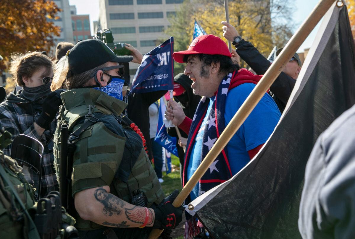 A Trump supporter shouts down counter-protesters during a demonstration over election ballot counting outside the Michigan State Capitol building on November 07, 2020, in Lansing, Mich. (John Moore/Getty Images)