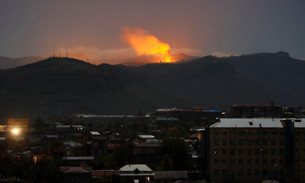 Explosions are seen during fighting between Armenian and Azerbaijani forces near Shushi outside of Stepanakert, the separatist region of Nagorno-Karabakh, on Nov. 7, 2020. (AP Photo)
