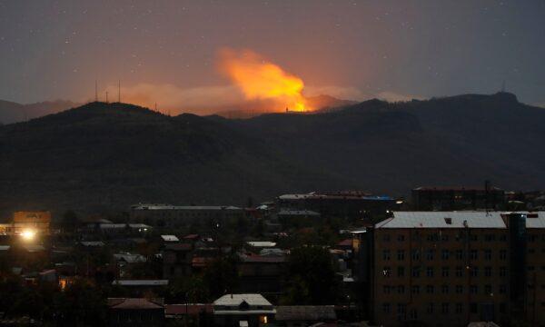 Bursts of explosions, smoke, and flame are seen during fighting between Armenian and Azerbaijan's forces near Shushi outside Stepanakert, the separatist region of Nagorno-Karabakh, on Nov. 7, 2020. (AP Photo)