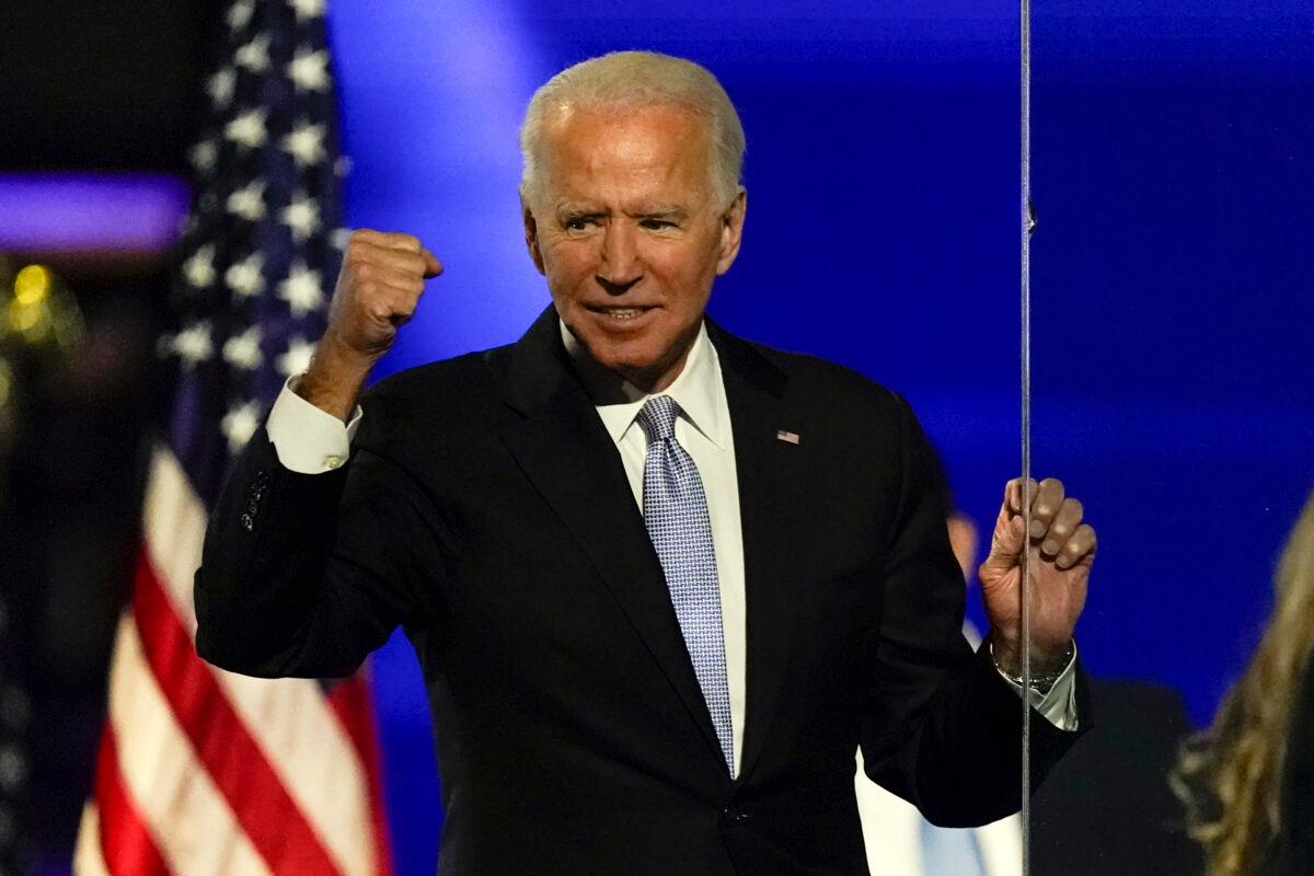 Democratic presidential candidate Joe Biden gestures to supporters in Wilmington, Del., on Nov. 7, 2020. (Andrew Harnik/AP Photo)