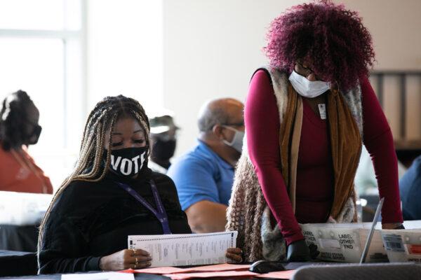 Fulton county workers continue to count absentee ballots at State Farm Arena in Atlanta, Ga., on Nov. 6, 2020. (Jessica McGowan/Getty Images)