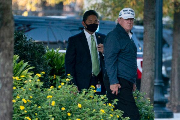 President Donald Trump returns to the White House after playing a round of golf, in Washington on Nov. 7, 2020. (Evan Vucci/AP Photo)