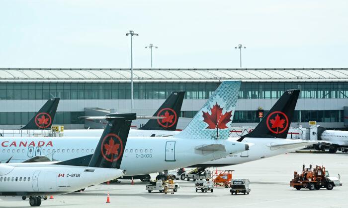 Air Canada Reports $685M Third Quarter Loss Compared With $636M Profit a Year Ago