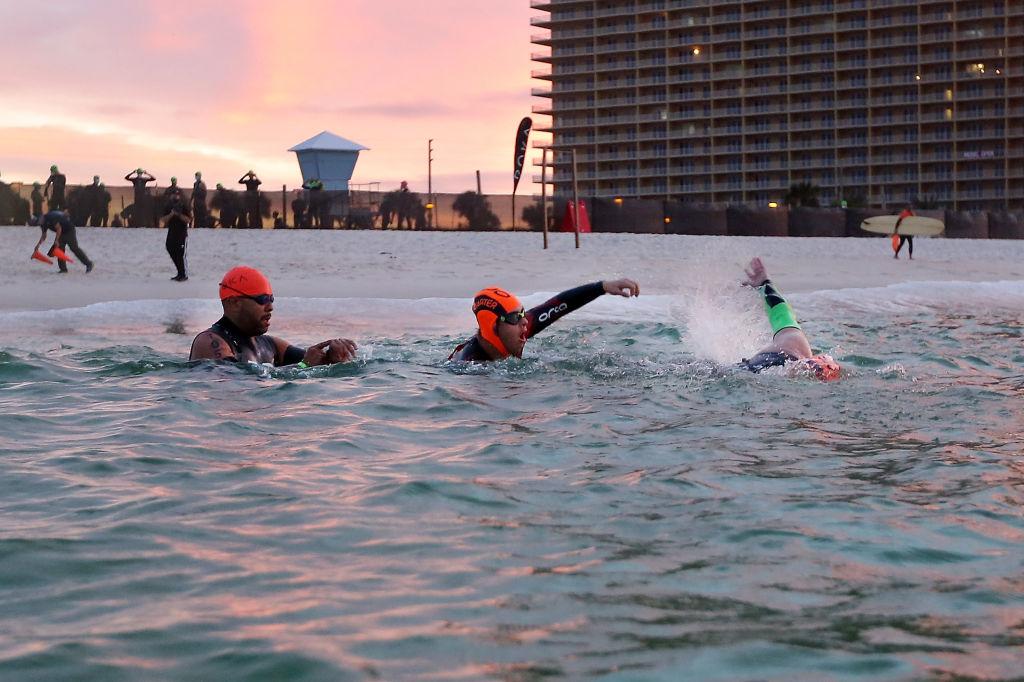 Chris Nikic, center, begins the swimming portion of the IRONMAN Florida on Nov. 7, 2020, in Panama City Beach, Florida. (Jonathan Bachman/Getty Images)