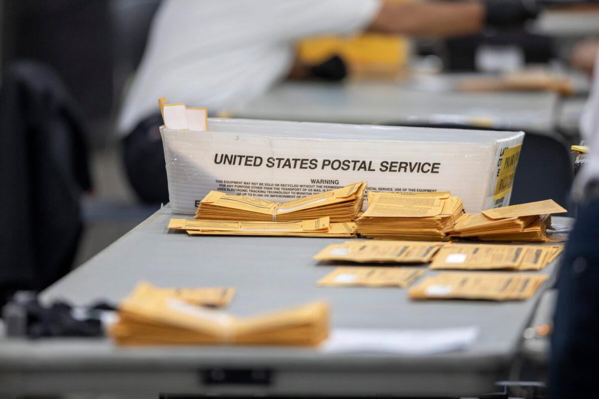 Absentee ballots at the Central Counting Board sit on a desk as they wait to be processed in the TCF Center in Detroit, Mich., on Nov. 4, 2020. (Elaine Cromie/Getty Images)