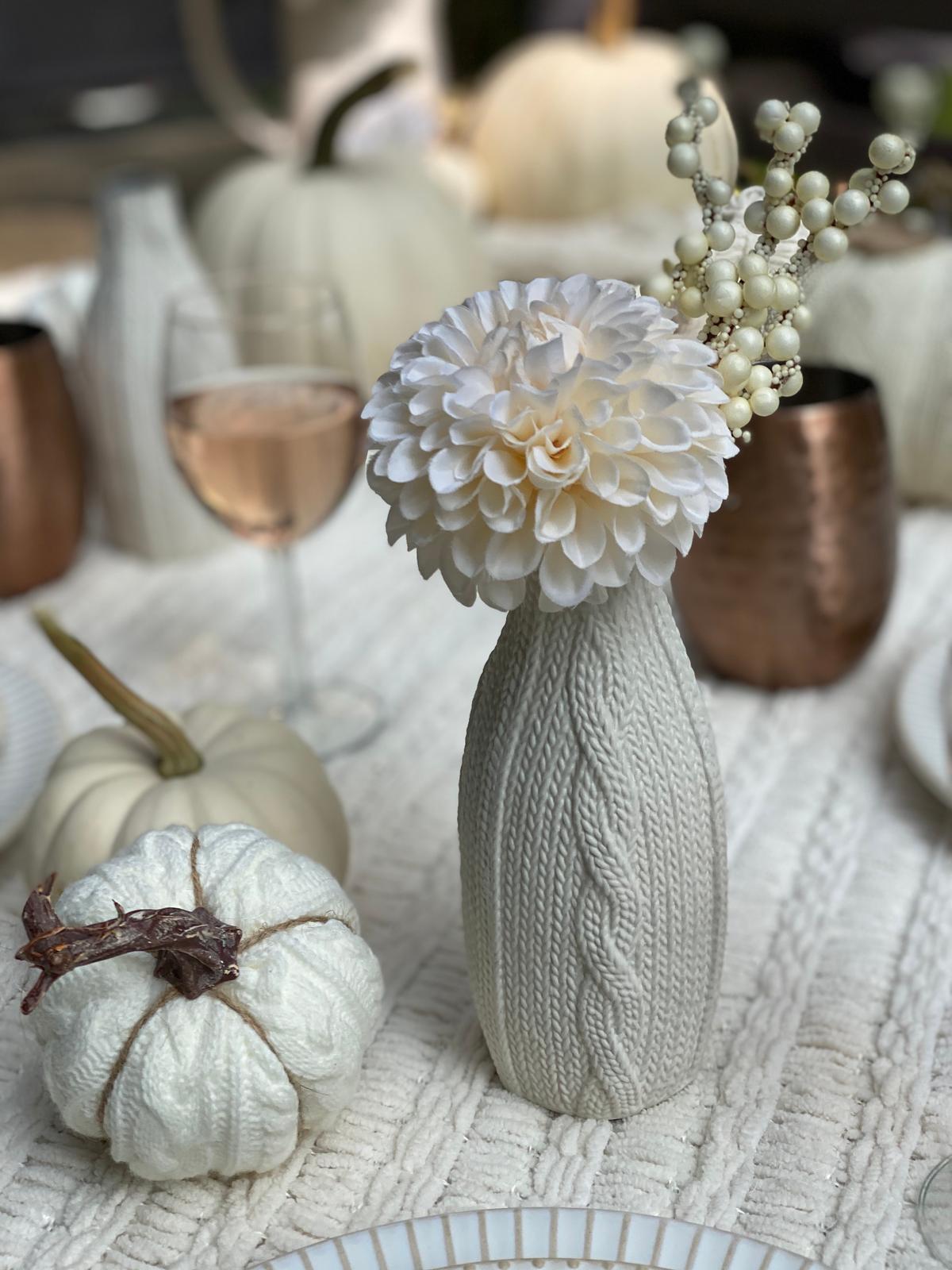 Mini knitted pumpkins and vases adorn the table. (Courtesy of Yelena Oleynik)