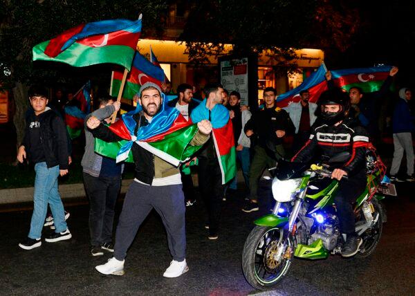 Azerbaijanis celebrate in the streets of capital Baku on Nov. 10, 2020. (Tofik Babayev/AFP via Getty Images)