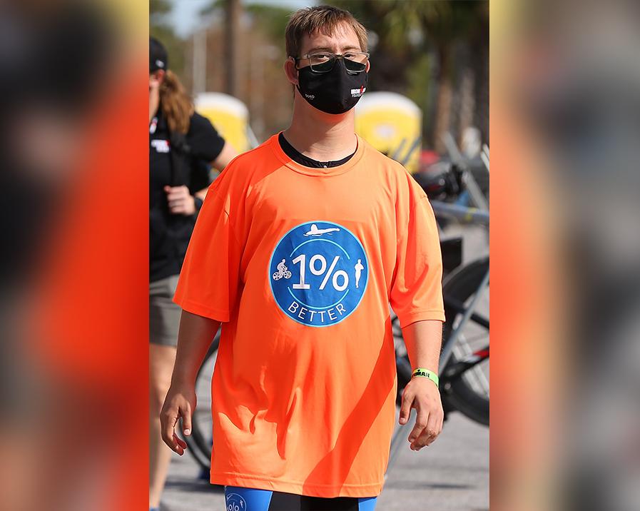 Chris Nikic walks to check in his bike the day before the IRONMAN Florida on Nov. 6, 2020, in Panama City Beach, Florida. (Jonathan Bachman/Getty Images)