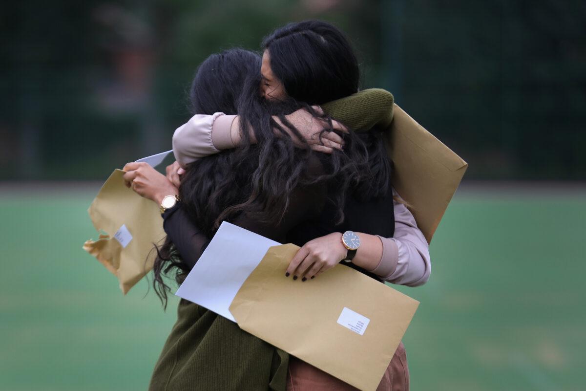 Pupils at Withington Girls' School react as they open their GCSE exam results in Manchester, England, on August 25, 2016. (Christopher Furlong/Getty Images)