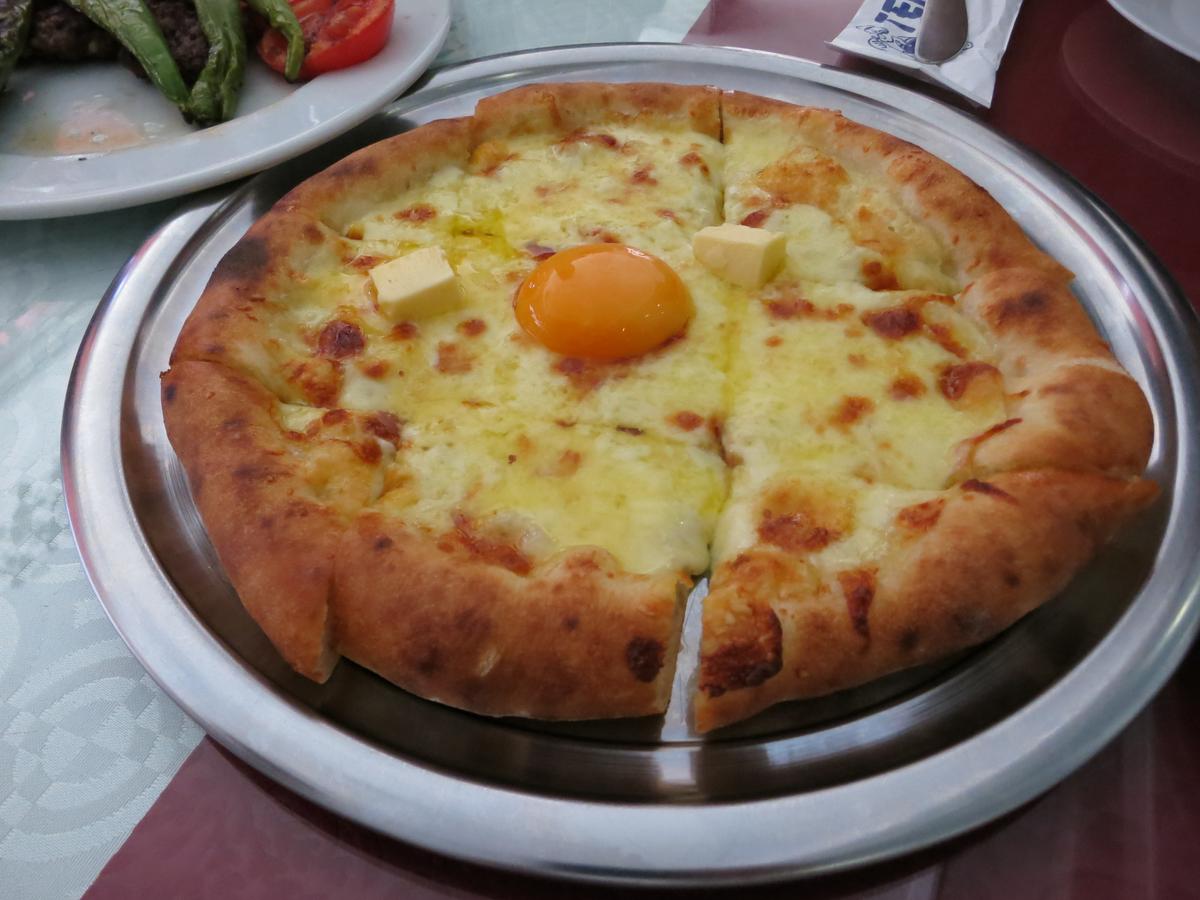 Temel Reis's pide with Trabzon cheese, butter, and a soft egg yolk. (Kevin Revolinski)