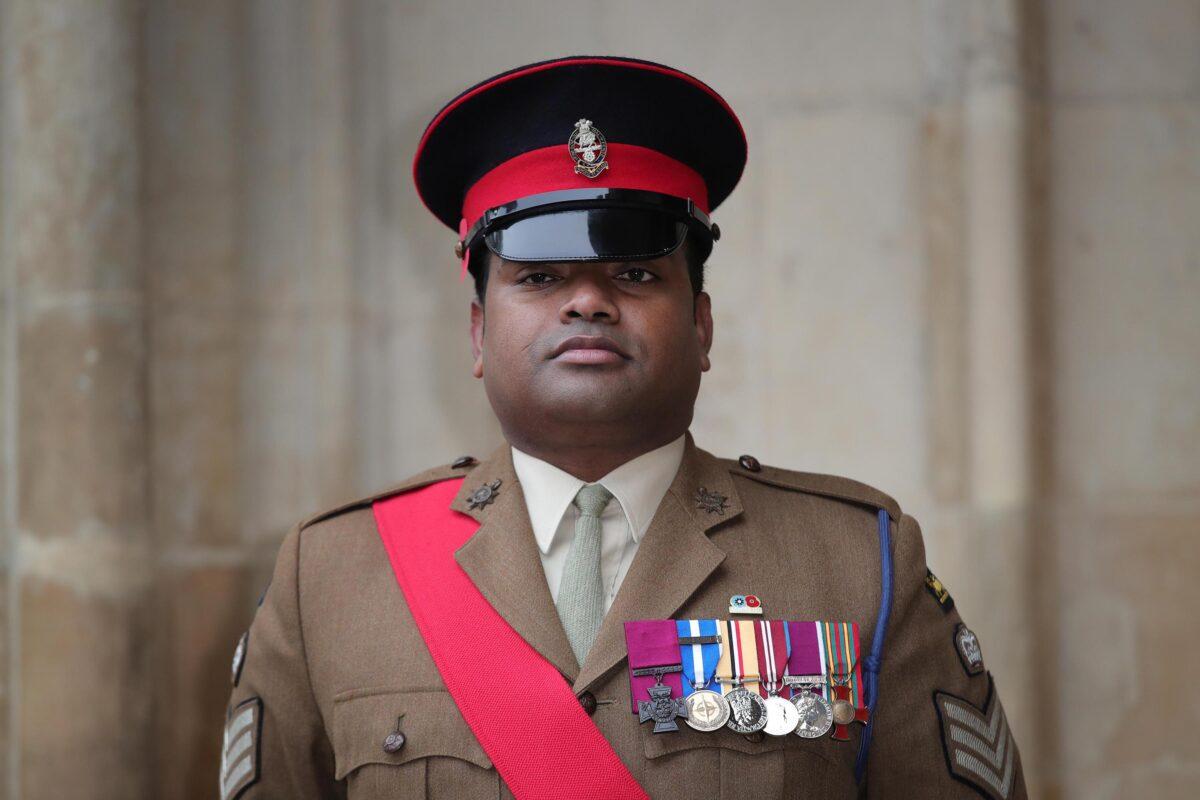 Victoria Cross recipient Johnson Beharry arrives at Westminster Abbey to attend a service to mark Armistice Day and the centenary of the burial of the unknown warrior on Nov. 11, 2020, in London, England. (Aaron Chown/WPA Pool/Getty Images)