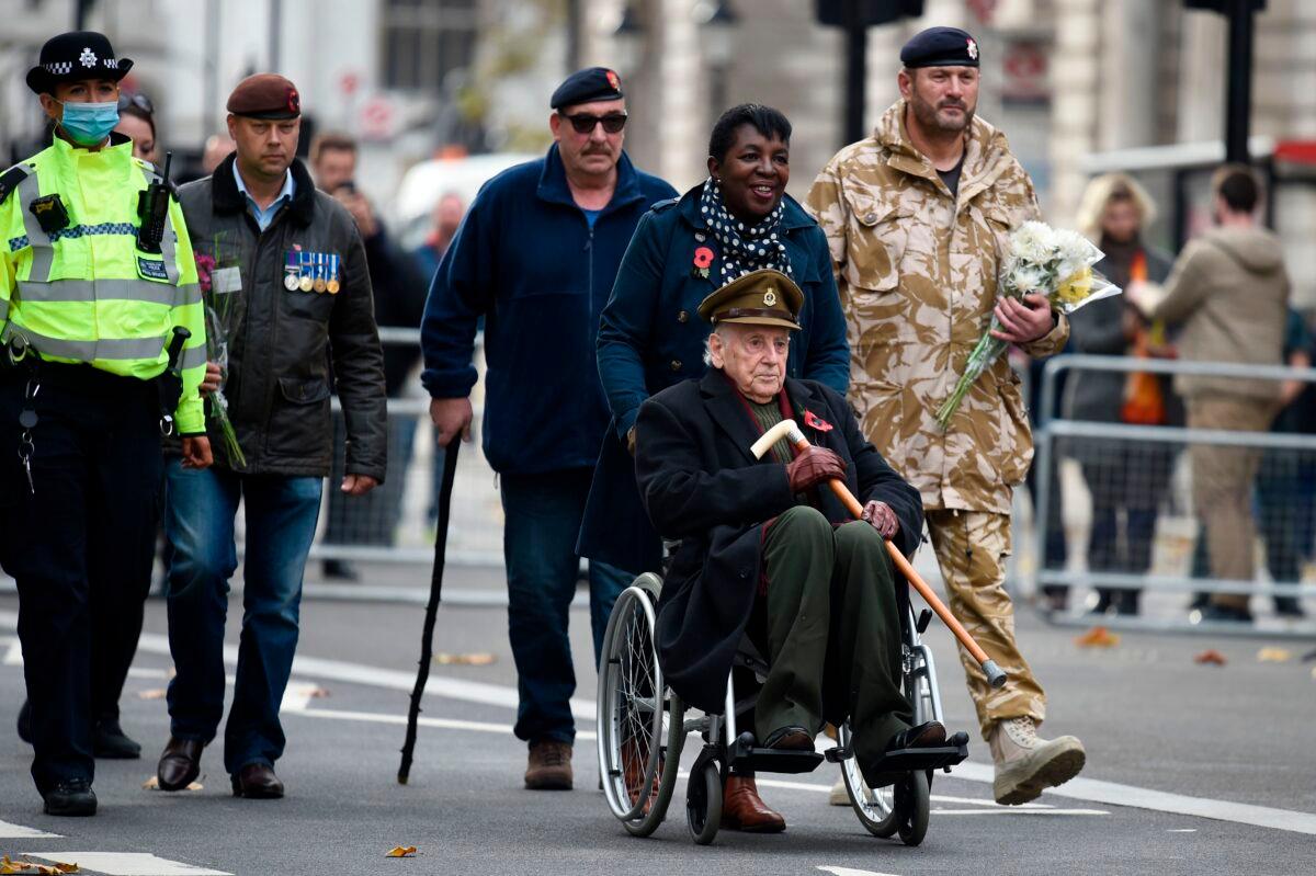 Veterans arrive to observe a 2-minute silence for Armistice Day in remembrance of the nation's war dead on Nov. 11, 2020, in London. (Daniel Leal-Olivas/AFP)