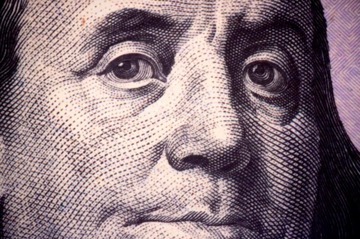 A close-up photo of Benjamin Franklin, one of the founding fathers of the United States, as seen on a U.S. $100 Federal Reserve Note on Nov. 17, 2015 (Paul J. Richards/AFP via Getty Images)