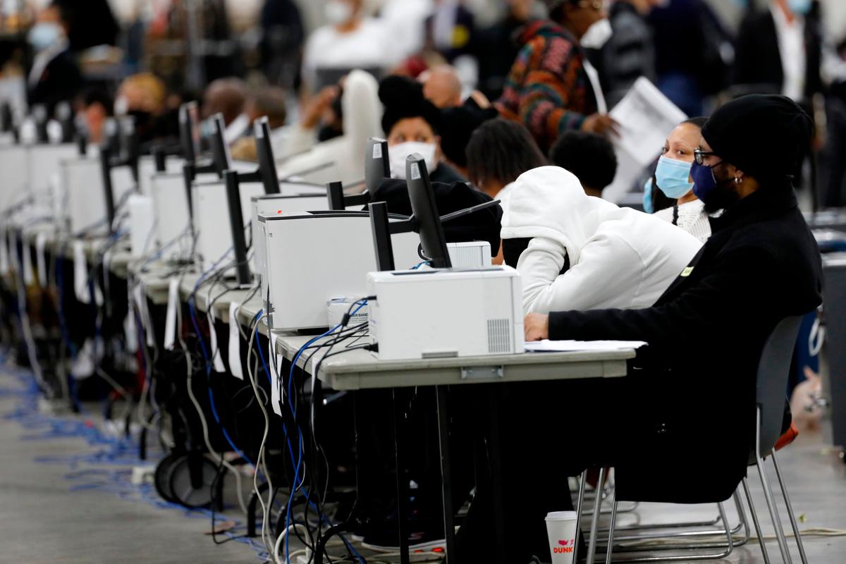 Detroit election workers work on counting absentee ballots for the 2020 general election at TCF Center in Detroit, Mich., on Nov. 4, 2020. (Jeff Kowalsky/AFP via Getty Images)