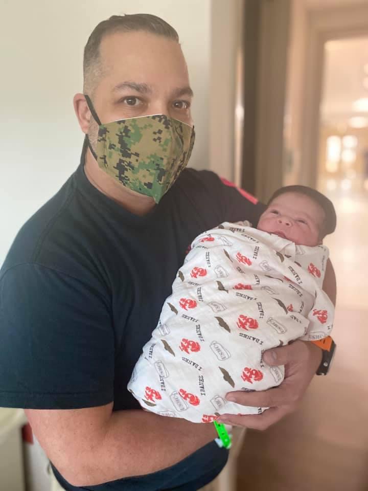 Retired U.S. Marine Corps Staff Sgt. Orlando Ibanez with his newborn son (Courtesy of <a href="https://mercymiami.com/">Mercy Hospital</a>)