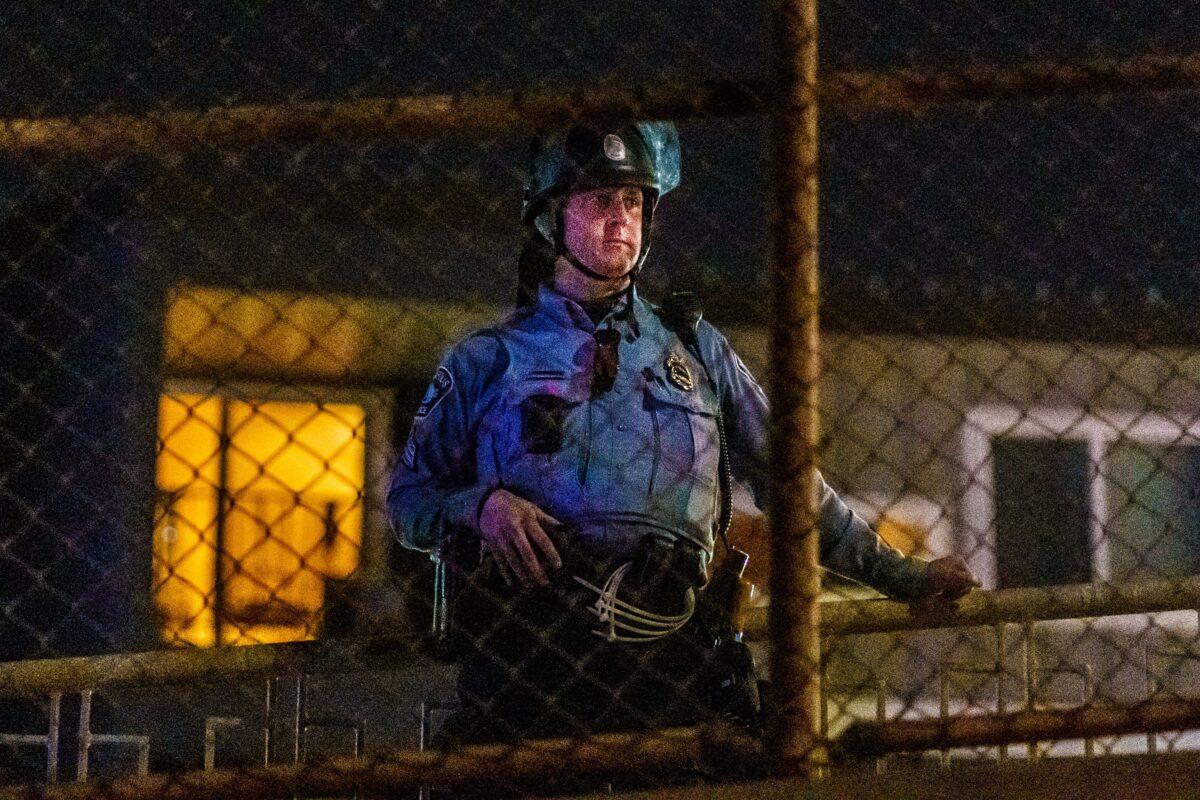 A Minneapolis Police Department officer stands in a line to control demonstrators after declaring an unlawful assembly in Minneapolis, Minn., on Nov. 4, 2020. (Kerem Yucel/AFP via Getty Images)
