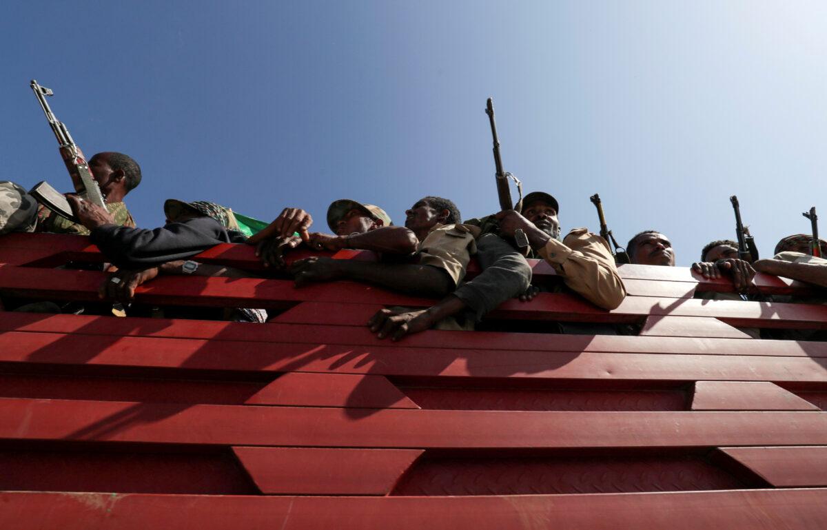 Members of Amhara region militias ride on their truck as they head to the mission to face the Tigray People's Liberation Front (TPLF), in Sanja, Amhara region, near a border with Tigray, Ethiopia, on Nov. 9, 2020. (Tiksa Negeri/Reuters)