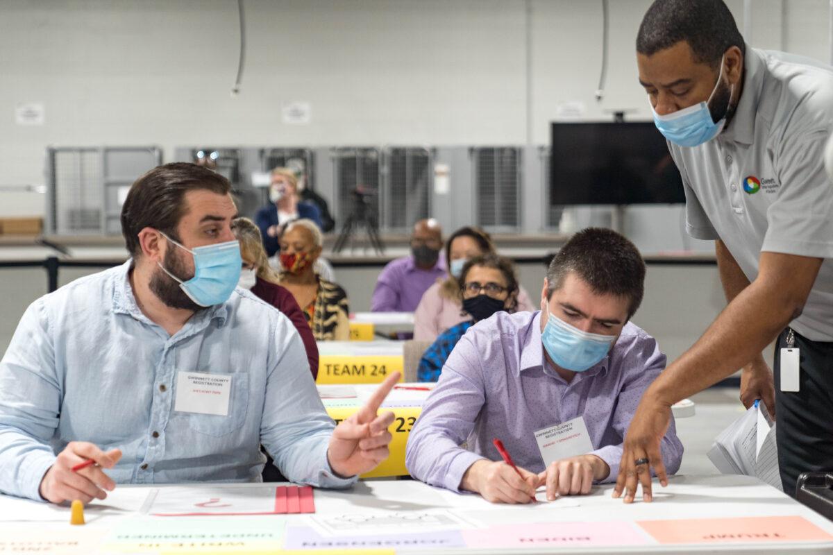Gwinnett County workers begin a recount of presidential election ballots in Lawrenceville, Georgia, on Nov. 13, 2020. (Megan Varner/Getty Images)
