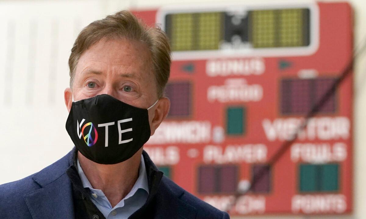 Connecticut Gov. Ned Lamont prepares to cast his vote at Greenwich High School in Greenwich, Conn., on Nov. 3, 2020. (Timothy A. Clary/AFP via Getty Images)