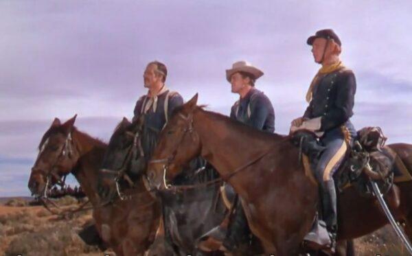 (L–R) Capt. Nathan Brittles (John Wayne) and his two young charges, Lt. Cohill (John Agar) and 2nd Lt. Pennell (Harry Carey Jr.), each hoping to win the hand of one young lady. (Warner Archive Collection)