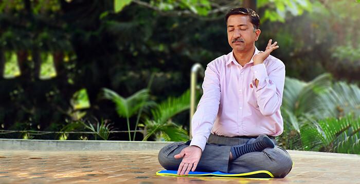 C. N. Pradeep Kumar, 51, a school headmaster and education officer from India, doing the fifth exercise of Falun Gong. (NTD)