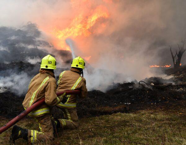 Fire fighters tackle a blaze involving a large quantity of tyres at a location near the railway's Bradford Interchange in Bradford, Northern England, on Nov. 16, 2020. (West Yorkshire Fire & Rescue Service)