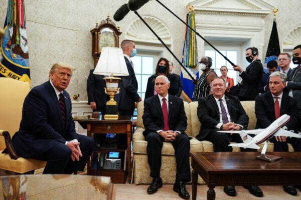 U.S. President Donald Trump talks to reporters while hosting Iraqi Prime Minister Mustafa Al-Kadhimi (not pictured), and (L-R) Vice President Mike Pence, Secretary of State Mike Pompeo, and National Security Advisor Robert O'Brien in the Oval Office at the White House in Washington, DC on Aug. 20, 2020. (Anna Moneymaker-Pool/Getty Images)