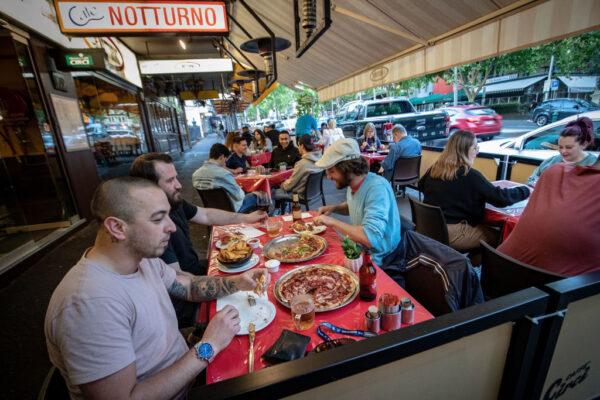 People enjoy outdoor eating on Lygon Street in Carlton in Melbourne, Australia after lockdown on Oct. 28, 2020. (Darrian Traynor/Getty Images)