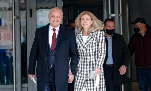 Incumbent Moldovan President Igor Dodon and his wife Galina smile while walking out of a voting station during the country's presidential election runoff in Chisinau, on Nov. 15, 2020. (Roveliu Buga/AP Photo)