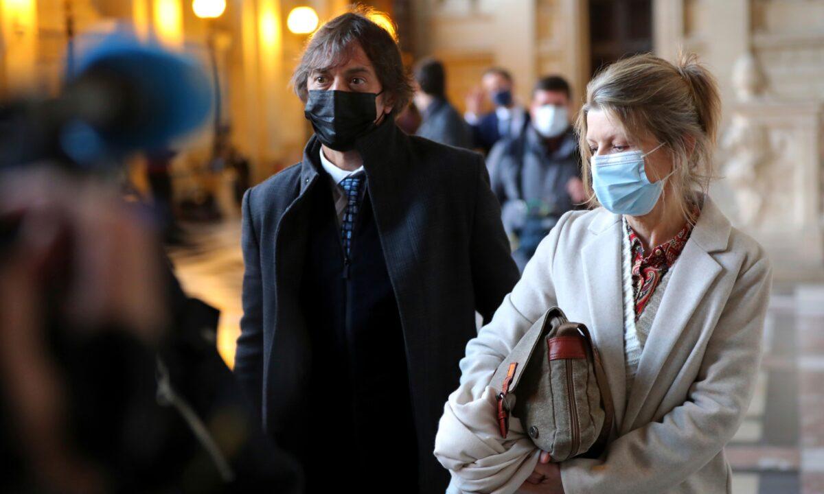 French-American Mark Moogalian and his wife Isabelle leave on the opening day of the Thalys attack trial, at the Paris courthouse, on Nov. 16, 2020. (Thibault Camus/AP Photo)