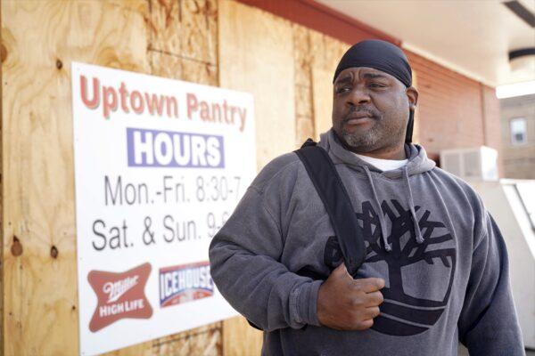 Antonio Franklin stands on 22nd Avenue in Kenosha, Wis.—an area badly damaged by rioting in August—on Nov. 12, 2020. (Cara Ding/The Epoch Times)