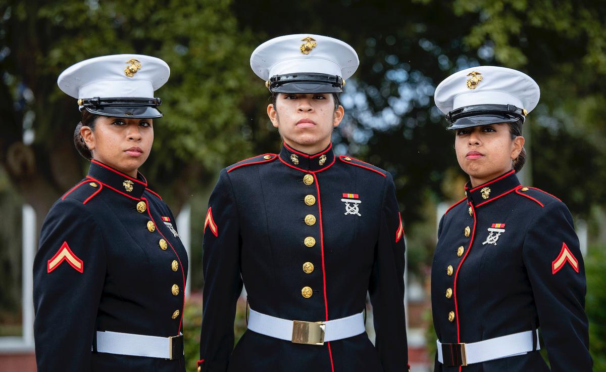 Sisters Melissa, Maria, and Vanessa Placido Jaramillo pose on the Peatross Parade Deck at MCRD Parris Island on Nov. 13, 2020. (<a href="https://www.dvidshub.net/image/6424167/sisters-blood-now-sisters-arms-two-sets-sisters-graduate-recruit-training">Sgt. Dana Beesley</a>/U.S. Marine Corps)