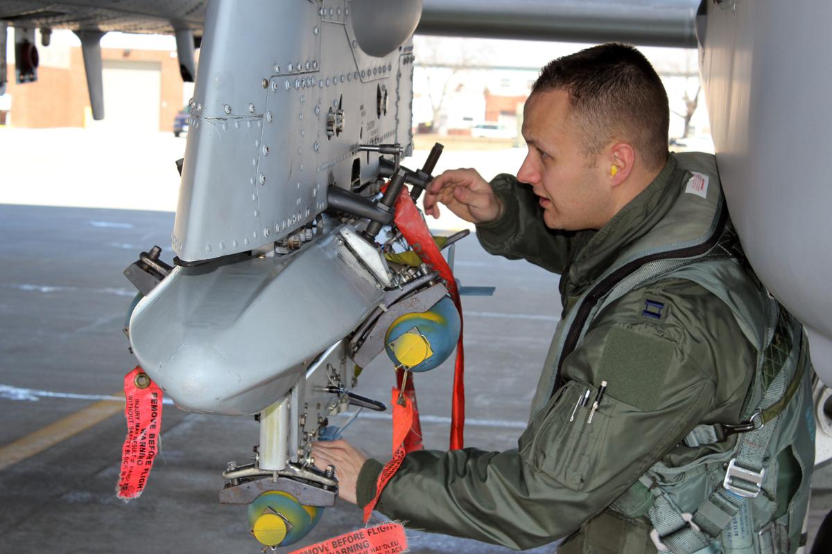 Then-Capt.Brett DeVries conducts a preflight inspection of an A-10 Thunderbolt II aircraft at Selfridge Air National Guard Base on March 26, 2014. (<a href="https://www.dvidshub.net/image/1199263/3-states-combine-michigan-csar">TSgt. Dan Heaton</a>/U.S. Air National Guard)