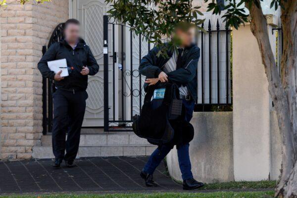 Federal agents leave the home of NSW Labor MP Shaoquett Moselmane in Rockdale, Sydney, Friday, June 26, 2020. (AAP Image/Bianca De Marchi)